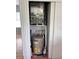 Utility closet featuring a water heater, HVAC system, and storage space at 5741 Soldier Cir # 202, Sarasota, FL 34233
