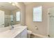 Well-lit bathroom with a white vanity, modern sink, and a glass-enclosed shower for a clean and bright design at 5957 Amberly Dr, Bradenton, FL 34208