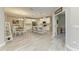 The open floor plan creates an airy atmosphere, seamlessly connecting the dining and kitchen areas at 5957 Amberly Dr, Bradenton, FL 34208