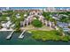 Breathtaking aerial view of waterfront community with lush landscaping, private docks, and sparkling waters at 6157 E Midnight Pass Rd # B51, Sarasota, FL 34242