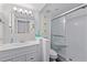 Bright bathroom featuring shower with glass door and a vanity at 6157 E Midnight Pass Rd # B51, Sarasota, FL 34242