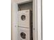 Laundry closet featuring a stacked washer and dryer at 6157 E Midnight Pass Rd # B51, Sarasota, FL 34242