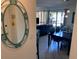 View from a decorative mirror in the entryway towards the living and dining area of the residence at 6157 E Midnight Pass Rd # B51, Sarasota, FL 34242