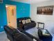 Comfortable seating in the living area with modern decor and pops of color at 6157 E Midnight Pass Rd # B51, Sarasota, FL 34242