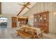 Dining area with custom woodwork and a view of the outdoor patio, dining table, and access to the kitchen at 621 Ivanhoe Ln, Holmes Beach, FL 34217