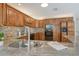 Elegant kitchen features granite countertops, stainless steel appliances, and custom wood cabinetry at 621 Ivanhoe Ln, Holmes Beach, FL 34217