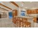 Open concept kitchen with breakfast bar overlooking the pool and waterfront at 621 Ivanhoe Ln, Holmes Beach, FL 34217
