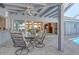 Relaxing lanai with comfortable seating and a view of the home's interior at 621 Ivanhoe Ln, Holmes Beach, FL 34217