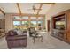Cozy living room showcasing a seating arrangement and serene views of the outdoors at 621 Ivanhoe Ln, Holmes Beach, FL 34217
