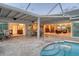 Spacious patio with easy access to kitchen, bedroom, living room and a beautiful pool at 621 Ivanhoe Ln, Holmes Beach, FL 34217