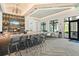 A modern bar area with sleek counter seating, bar, and views at 6248 Fish Eagle Ct, Nokomis, FL 34275