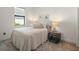 Cozy bedroom with neutral tones, decorated with nautical themed art at 6248 Fish Eagle Ct, Nokomis, FL 34275