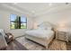 Bright bedroom with a large window view, neutral tones, and elegant furnishings at 6248 Fish Eagle Ct, Nokomis, FL 34275