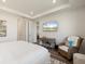 Relaxing bedroom with modern decor, television, and tranquil views at 6248 Fish Eagle Ct, Nokomis, FL 34275