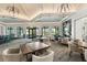 Spacious dining room with modern lighting, ample seating, and exterior views at 6248 Fish Eagle Ct, Nokomis, FL 34275