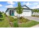 Charming single-story home with a well-manicured lawn, stone accents, and inviting curb appeal, showcasing modern design elements at 6248 Fish Eagle Ct, Nokomis, FL 34275