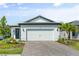 Charming single-story home featuring a spacious two-car garage and a beautifully landscaped front yard at 6248 Fish Eagle Ct, Nokomis, FL 34275