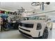 Spacious two car garage with epoxy flooring and overhead bike racks at 6248 Fish Eagle Ct, Nokomis, FL 34275