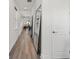 Hallway featuring hardwood floors and contemporary design elements at 6248 Fish Eagle Ct, Nokomis, FL 34275