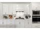 Well-equipped kitchen featuring stainless steel appliances, stylish cabinetry, and modern fixtures at 6248 Fish Eagle Ct, Nokomis, FL 34275