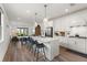 Open-concept kitchen featuring a center island, stainless appliances, and seamless access to the living area at 6248 Fish Eagle Ct, Nokomis, FL 34275