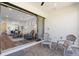 Covered outdoor patio with lounge chairs offering a seamless transition to the indoor living space at 6248 Fish Eagle Ct, Nokomis, FL 34275