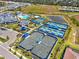 Aerial view showcasing tennis courts, other sport courts and community amenities at 6248 Fish Eagle Ct, Nokomis, FL 34275