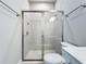 Modern bathroom features a glass-enclosed shower with tile surround and sleek fixtures at 6290 Mesa Gln, Bradenton, FL 34203
