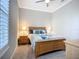 Bedroom featuring a decorative headboard, carpeting, and natural light at 6290 Mesa Gln, Bradenton, FL 34203