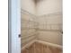 Walk-in closet featuring adjustable wire shelving for maximizing storage and organization at 6290 Mesa Gln, Bradenton, FL 34203