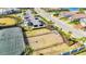Aerial view of the fenced dog park and tennis court in the community at 6290 Mesa Gln, Bradenton, FL 34203