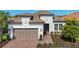 Charming single-Gathering home with a tile roof, attached garage, and beautifully landscaped front yard at 6290 Mesa Gln, Bradenton, FL 34203