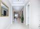 Inviting foyer boasts tile floors, recessed lighting, and views into the living areas at 6290 Mesa Gln, Bradenton, FL 34203