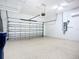 Clean garage with epoxy flooring and an automatic door at 6290 Mesa Gln, Bradenton, FL 34203