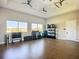 Well-equipped gym with various workout machines, weights, and ceiling fans at 6290 Mesa Gln, Bradenton, FL 34203