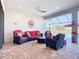 Covered lanai with comfortable seating and views of the backyard at 6290 Mesa Gln, Bradenton, FL 34203