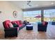 Covered lanai with comfortable seating and views of the pool and backyard at 6290 Mesa Gln, Bradenton, FL 34203