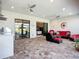 Large outdoor living space with multiple ceiling fans at 6290 Mesa Gln, Bradenton, FL 34203