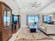 Bright living room boasts stylish furniture, a ceiling fan, and access to outdoor living space at 6290 Mesa Gln, Bradenton, FL 34203