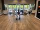 Bright lobby area featuring modern seating and views of the outdoor pool and lounge area at 6290 Mesa Gln, Bradenton, FL 34203