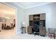 Cozy home office includes built-in shelving and a view into the elegant dining room at 6290 Mesa Gln, Bradenton, FL 34203