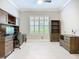 Office with wood furniture, a ceiling fan, and a window with plantation shutters at 6290 Mesa Gln, Bradenton, FL 34203