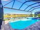 Screened in pool has attached spa and gorgeous water views of the lake and surrounding community at 6290 Mesa Gln, Bradenton, FL 34203