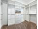 Spacious walk-in closet with extensive shelving and drawer space for optimal storage and organization at 6290 Mesa Gln, Bradenton, FL 34203