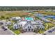 Overhead shot of a community center with an amazing pool, tennis and bocce ball courts, and a clubhouse at 6295 Crested Eagle Ln, Nokomis, FL 34275