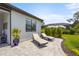 Outdoor patio includes lounge chairs, pool screen, and lush landscaping for relaxing in the sun at 6295 Crested Eagle Ln, Nokomis, FL 34275