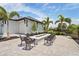 Stylish outdoor fire pit area with comfortable seating, ideal for socializing and relaxation at 6295 Crested Eagle Ln, Nokomis, FL 34275