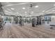 Bright, well-equipped gym featuring multiple weight machines and large windows with views of the community at 6295 Crested Eagle Ln, Nokomis, FL 34275