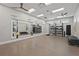Bright and well-equipped gym with weights, TRX station, medicine balls, and mirror at 6295 Crested Eagle Ln, Nokomis, FL 34275