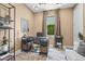 Inviting home office with modern desk, stylish shelving, and a comfortable seating area at 6295 Crested Eagle Ln, Nokomis, FL 34275